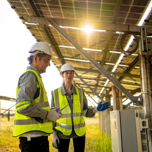 People inspecting solar battery